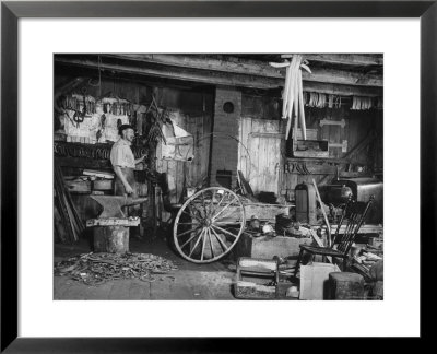 Blacksmith Working In His Shop by John Phillips Pricing Limited Edition Print image