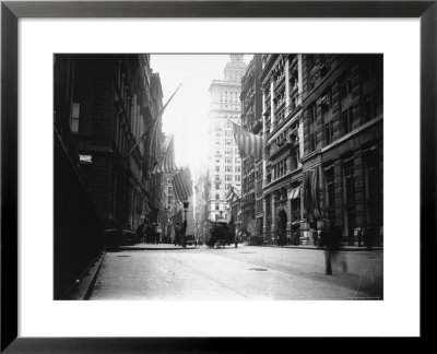 People And Horse Drawn Carts On Wall St, Where American Flags Fly From Buildings by George B. Brainerd Pricing Limited Edition Print image