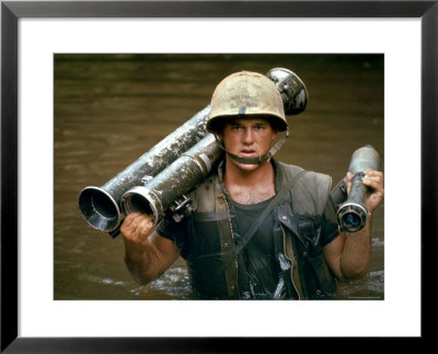 American Marine Pfc. Phillip Wilson Carrying Bazooka Across Stream Near Dmz During Vietnam War by Larry Burrows Pricing Limited Edition Print image