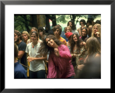 Psylvia Dressed In Pink Indian Shirt, Dancing In Midst Of Crowd During Woodstock Music/Art Festival by Bill Eppridge Pricing Limited Edition Print image