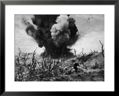 Us Marines Crouching Behind Hillside Rock Cover, Blowing Up Cave Connected To Japanese Blockhouse by W. Eugene Smith Pricing Limited Edition Print image