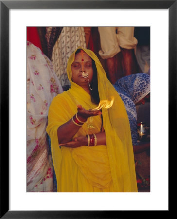 Hindu Woman Pilgrim Holding Fire, Varanasi (Benares), Uttar Pradesh State, India by John Henry Claude Wilson Pricing Limited Edition Print image