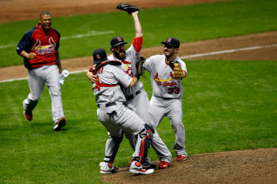 Cardinals V Brewers - Oct. 16: Adron Chambers, Yadier Molina, Jason Motte And Daniel Descalso by Scott Boehm Pricing Limited Edition Print image