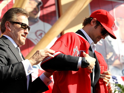 Los Angeles Angels Of Anaheim, Ca - December 10: Newly Signed C.J. Wilson And Arturo Moreno by Stephen Dunn Pricing Limited Edition Print image