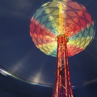 Illuminated Chairoplane Against Dark Sky by Jens Lucking Pricing Limited Edition Print image
