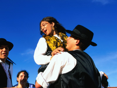 Man Lifting Up His Daughter At Festa De Santo Antonio, Lisbon, Portugal by Alain Evrard Pricing Limited Edition Print image