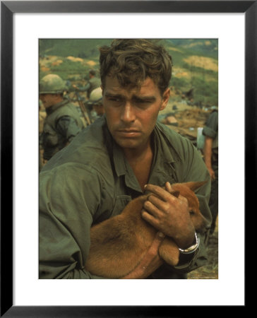 American Soldier Cradling Dog While Under Siege At Khe Sanh by Larry Burrows Pricing Limited Edition Print image