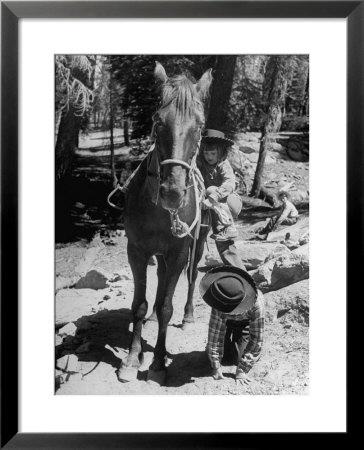 Judy Gordon Mounting Horse With Help Of Sister Becky Gordon by Allan Grant Pricing Limited Edition Print image