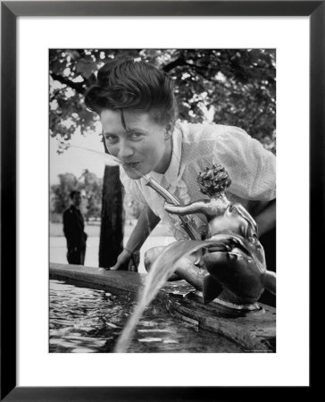 Woman Drinking From A Water Fountain by Yale Joel Pricing Limited Edition Print image