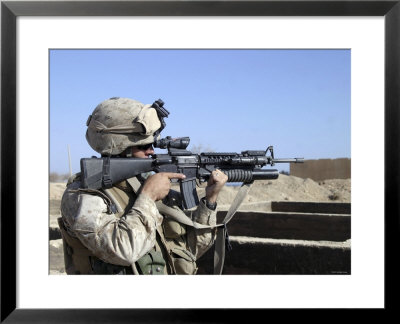 Us Marine Sites Through The Scope Atop His 556Mm M16a2 Rifle by Stocktrek Images Pricing Limited Edition Print image