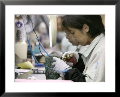 Woman Assembling Computer Boards, Taipei, Taiwan by Brent Winebrenner Pricing Limited Edition Print image