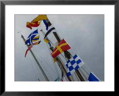 Nautical Flags Hanging From The Wooden Mast Of A Sailing Ship, Mystic, Connecticut by Todd Gipstein Pricing Limited Edition Print image