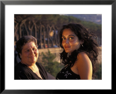Two Women Look Out During Sunset In Naples, Italy by Richard Nowitz Pricing Limited Edition Print image
