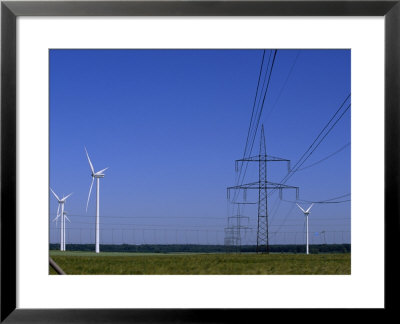 Windmills And High Voltage Transmission Lines In A Clear Blue Sky, Mecklenburg-Vorpommern, Germany by Norbert Rosing Pricing Limited Edition Print image