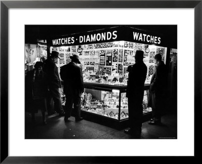 Customers Peering At The Wares Inside A Small, Brightly Lit Times Square Jewelry And Watch Shop by Peter Stackpole Pricing Limited Edition Print image