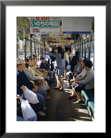 Passengers, Interior A Public Tram, Nagasaki, Island Of Kyushu, Japan by Christopher Rennie Pricing Limited Edition Print image