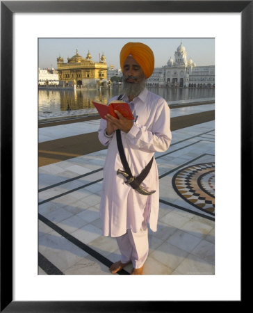 Sikh Pilgrim With Orange Turban, White Dress And Dagger, Reading Prayer Book, Amritsar by Eitan Simanor Pricing Limited Edition Print image