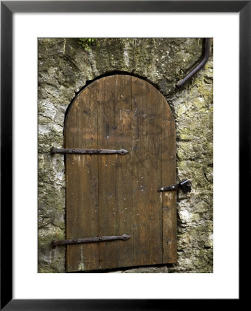 Detail Of Old Wooden Door In Stone Wall, Tallinn, Estonia by Nancy & Steve Ross Pricing Limited Edition Print image