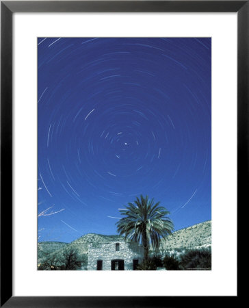 Startrails Around The Polaris And Full Moon by Rich Reid Pricing Limited Edition Print image