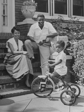 Baseball Star Jackie Robinson Sitting On Steps With Wife And Son by Nina Leen Pricing Limited Edition Print image