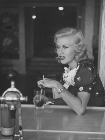 Ginger Rogers Sitting At A Soda Fountain With Glass Of Cola by Peter Stackpole Pricing Limited Edition Print image