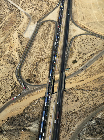 Californian Traffic Jam Clogging The I-15 Freeway In Apple Valley, California, Usa by Jim Wark Pricing Limited Edition Print image