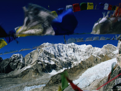 Prayer Flags Flying In The Wind At Kala Pattar In Khumbu by Jeff Cantarutti Pricing Limited Edition Print image