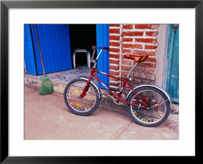 Children's Bicycle In Puerto Vallarta, The Colonial Heartland, Mexico by Tom Haseltine Pricing Limited Edition Print image