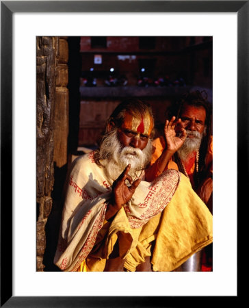 Portrait Of Two Sadhus Making Hand Signals In Taumadhi Square, Bhaktapur, Nepal by Ryan Fox Pricing Limited Edition Print image