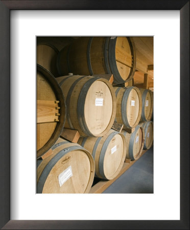French Oak Barrels Of Wine At Midnight Cellars Winery In Paso Robles, California by Rich Reid Pricing Limited Edition Print image