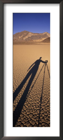 The Shadow Of A Photographer And His Camera And Tripod On Racetrack by Rich Reid Pricing Limited Edition Print image