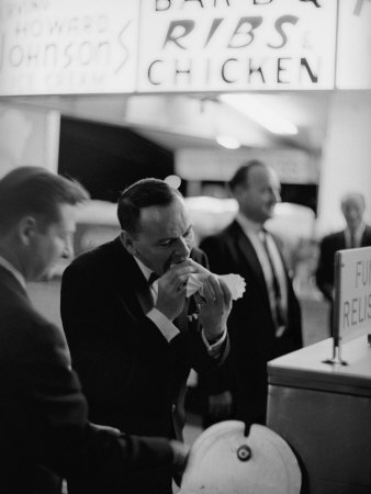 Entertainer Frank Sinatra Eating A Hot Dog by John Dominis Pricing Limited Edition Print image