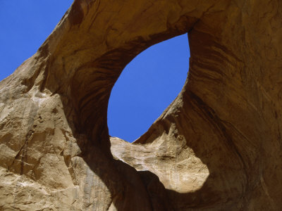 Eye, An Ancient Rock Formation In Monument Valley by Stephen St. John Pricing Limited Edition Print image