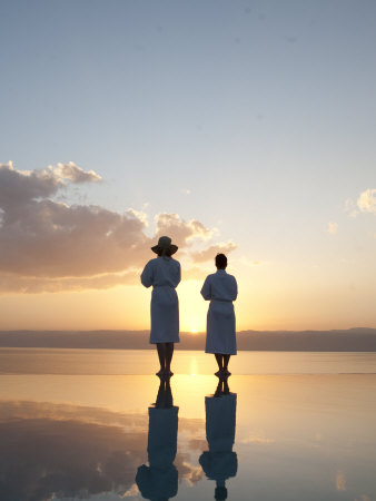 Two Friends Enjoy The Warm Sun On The Edge Of A Pool by Taylor S. Kennedy Pricing Limited Edition Print image