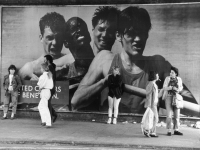 Standing By A Benetton Advertisement - Camden, London by Shirley Baker Pricing Limited Edition Print image