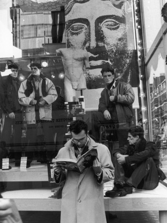 Man Reads A Magazine Outside Oxford Street Display by Shirley Baker Pricing Limited Edition Print image