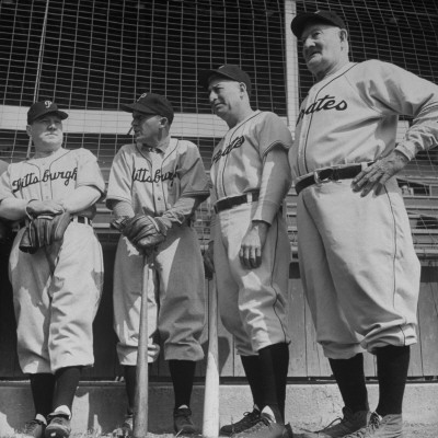 Frank E. Mckinney, Bing Crosby, Billy Meyer And Honus Wagner Outside The Dug Out by Loomis Dean Pricing Limited Edition Print image