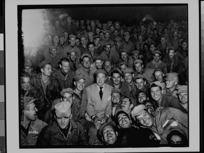 Comedian Bob Hope Sitting Amongst Audience Of Us Troops While On Uso Tour To Entertain, Korean War by Cpl. A. Klein Pricing Limited Edition Print image