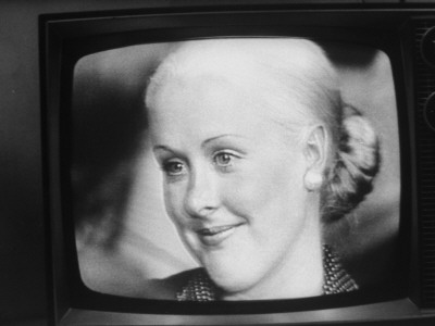 Ex-Nixon Aide John Dean's Wife, Maureen, Photographed From Tv Screen During Watergate Hearings by Gjon Mili Pricing Limited Edition Print image