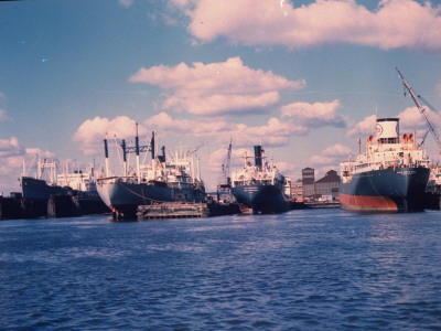 Esso Oil Tanker And Other Cargo Ships In Dock At Sun Shipbuilding And Dry Dock Co. Shipyards by Dmitri Kessel Pricing Limited Edition Print image