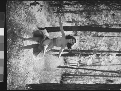 Pier Angeli In Strapless Party Dress As She Joyfully Twirls Around In The Midst Of The Woods by Allan Grant Pricing Limited Edition Print image
