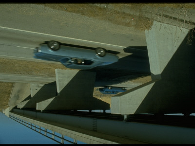 Car Passing Under Overpass On Unidentified Highway Regardingdangerous Road Situations by Ralph Crane Pricing Limited Edition Print image