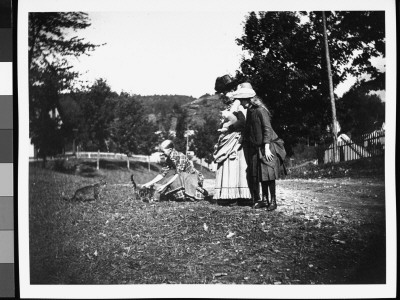 Mrs. Tomi With Jo Grimwood And Her Daughter Zelma Playing With Cats Out In The Country by Wallace G. Levison Pricing Limited Edition Print image