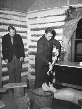 Men Cutting The Head Off Of An Effigy Of Adolf Hitler At The Voodoo Hexing Party by Thomas D. Mcavoy Pricing Limited Edition Print image
