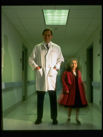 Dr. Jim Wilson With Little Girl Patient With Hypercholesterolemia In Hall by Ted Thai Pricing Limited Edition Print image