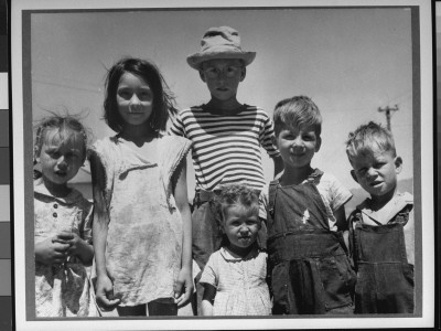Children Of Miners Standing In Their Tattered Clothes And Looking Happy by Russell Lee Pricing Limited Edition Print image