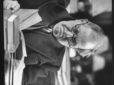 Frowning Man Reading Book In The New York Public Library by Alfred Eisenstaedt Pricing Limited Edition Print image