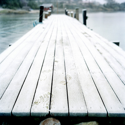 A Snow Covered Dock By A Lake by Maria Olsson Pricing Limited Edition Print image