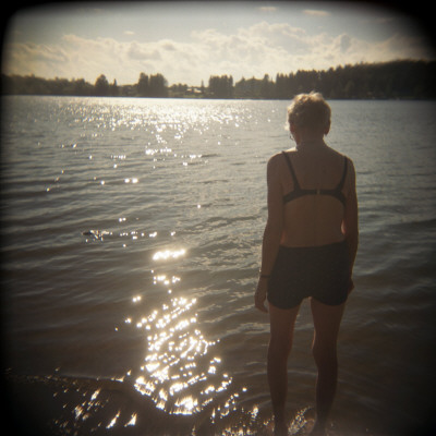 A Woman Going Into A Lake In Boden, Sweden by Inger Bladh Pricing Limited Edition Print image