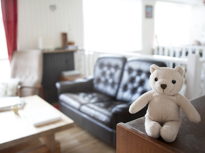 Teddy Bear On A Table In A Living Room by Atli Mar Pricing Limited Edition Print image